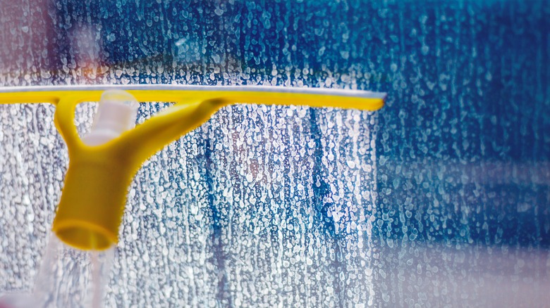 using a squeegee on shower