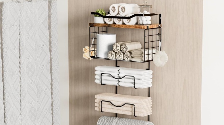 A multi-tier wall-mounted towel holder in a bathroom