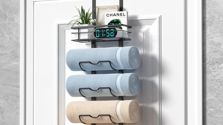 A multi-tier over-the-door towel holder