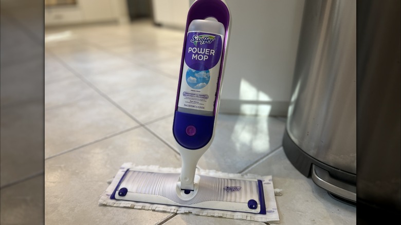 A Swiffer PowerMop being used on a tile floor