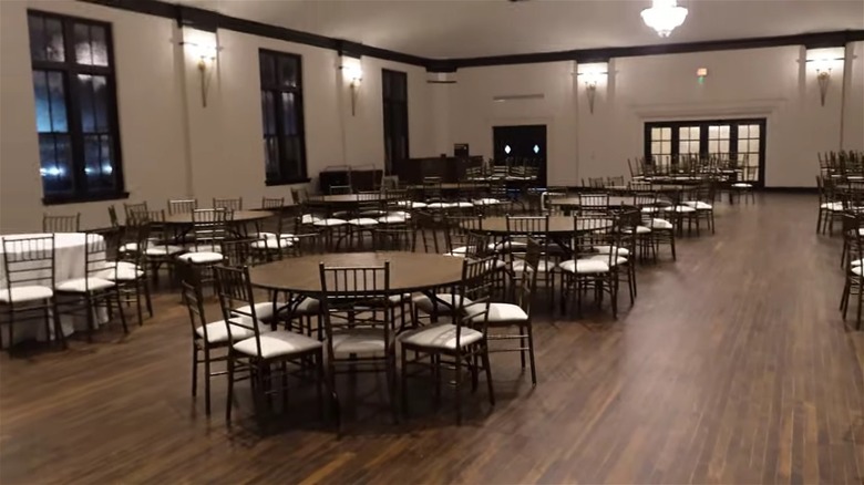 The ballroom at Hotel 1928 with white walls, wood floors, and black trim