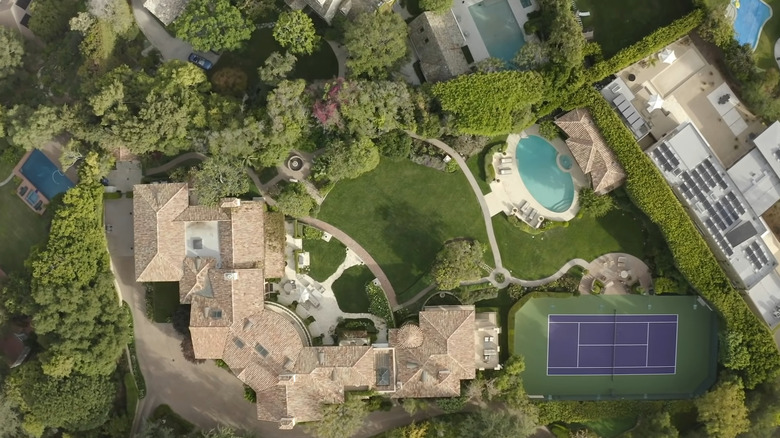 backyard with pool and tennis court