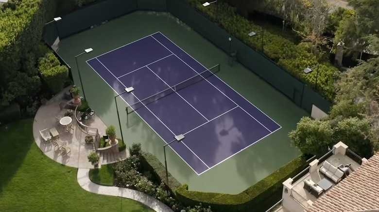 blue tennis court near trees