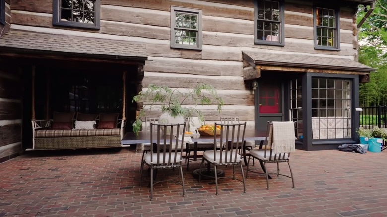 outdoor living area with brick patio