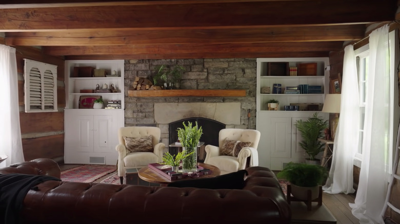 formal living room with stone fireplace