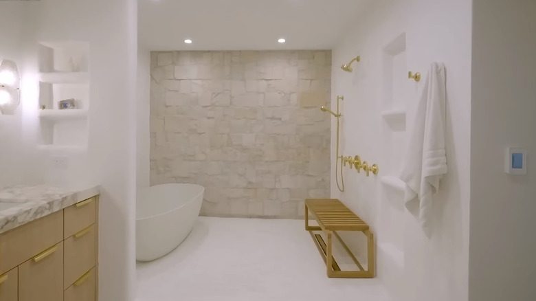 White plastered bathroom with stone accent wall