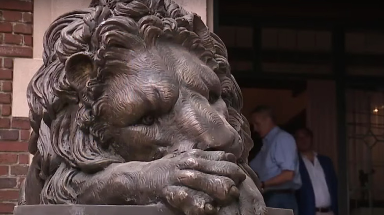 Stone lion on porch