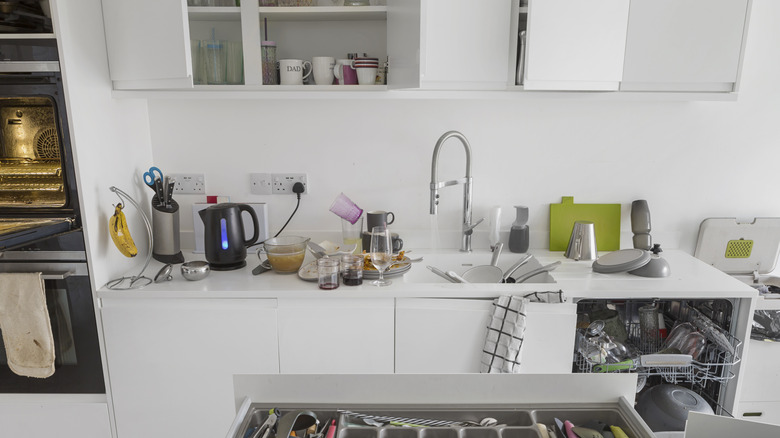 Cluttered white kitchen