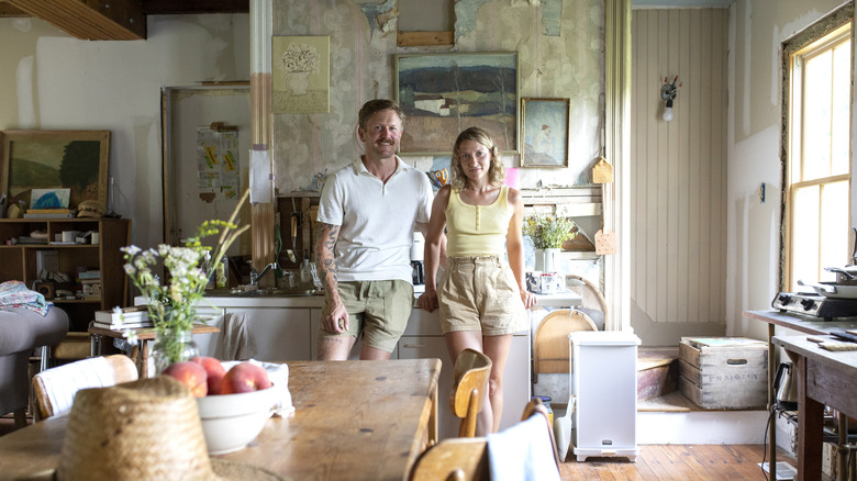 Tara Mangini and Percy Bright posing in kitchen