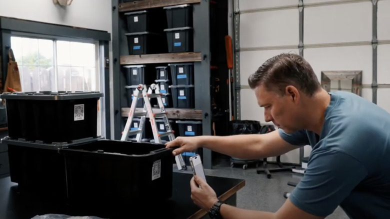 Man uses QR codes and his smartphone to organize storage totes in his garage