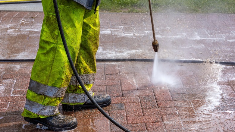 man cleaving pavers