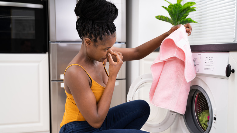 Woman with a smelly towel