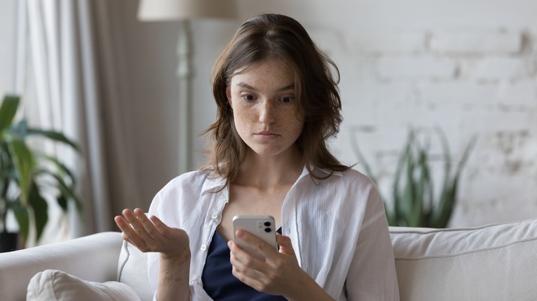 woman upset with phone