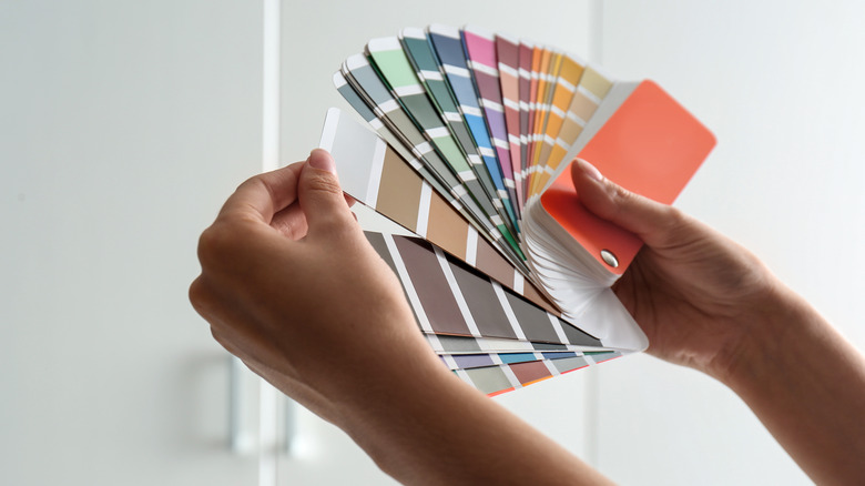 Person choosing paint color