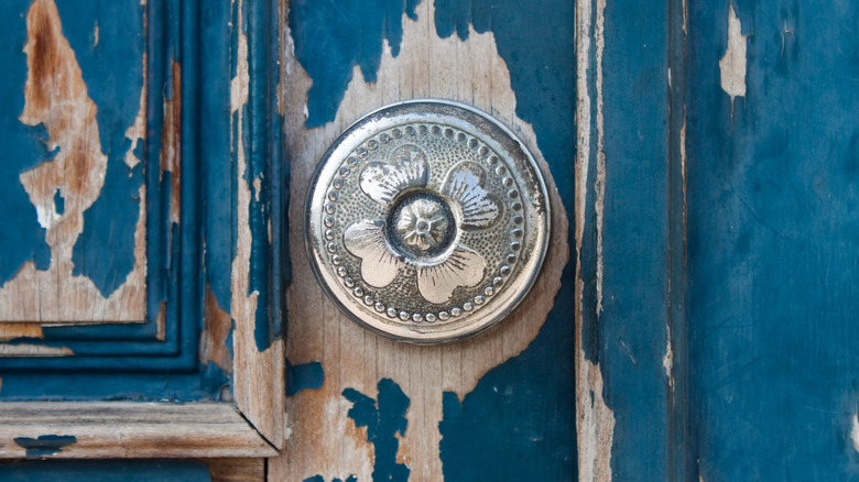 Peeling paint on front door