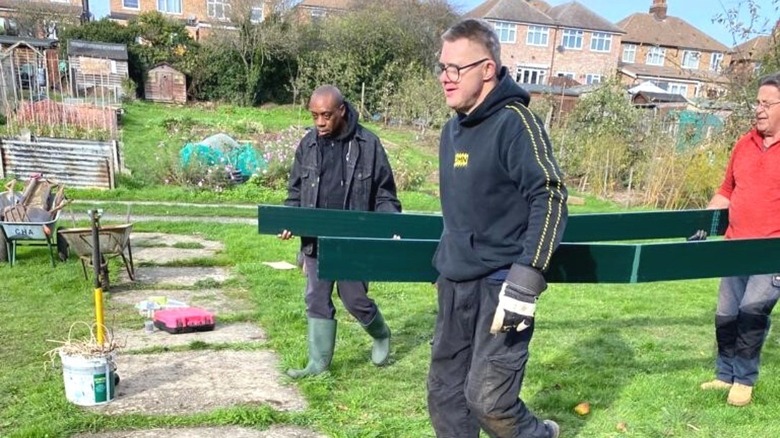 volunteers building a community garden