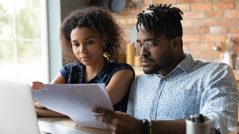 a couple going over paperwork