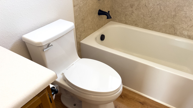 Plain white bathroom with toilet