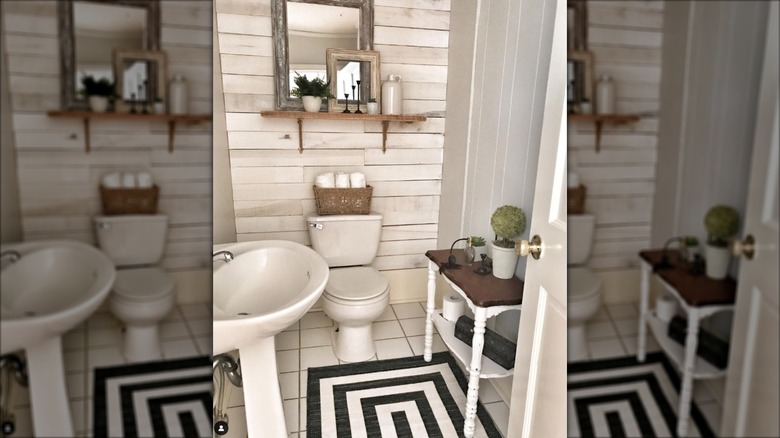 Bathroom with shiplap behind toilet