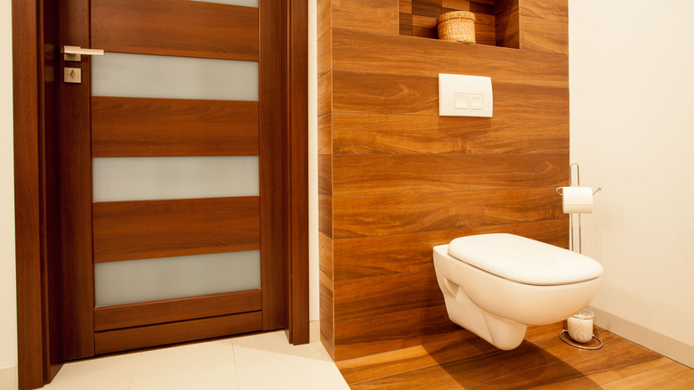 Wood wall behind toilet