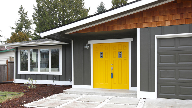 Yellow door on gray home