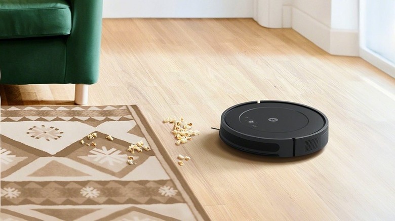 Roomba and popcorn on hardwood flooring