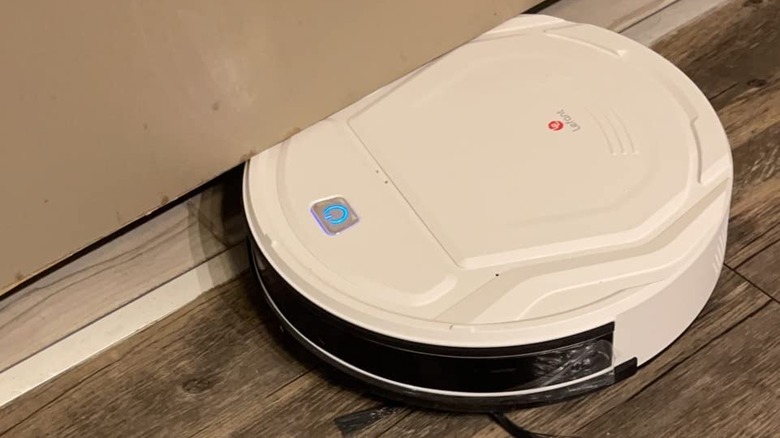 white robot vacuum edge cleaning hardwood