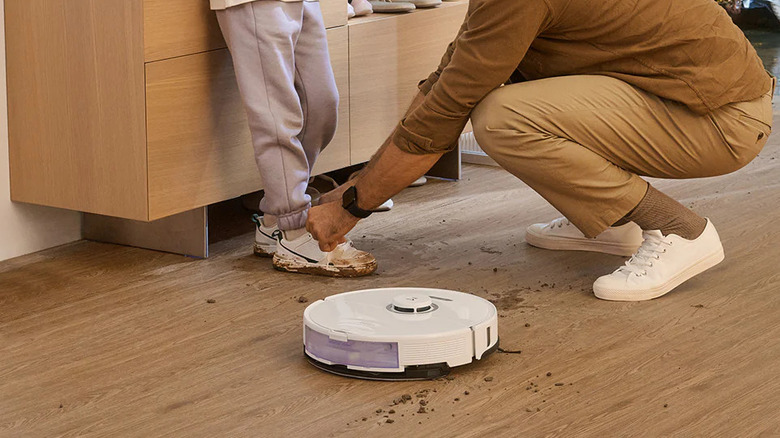 robot vacuum cleaning muddy hard floor