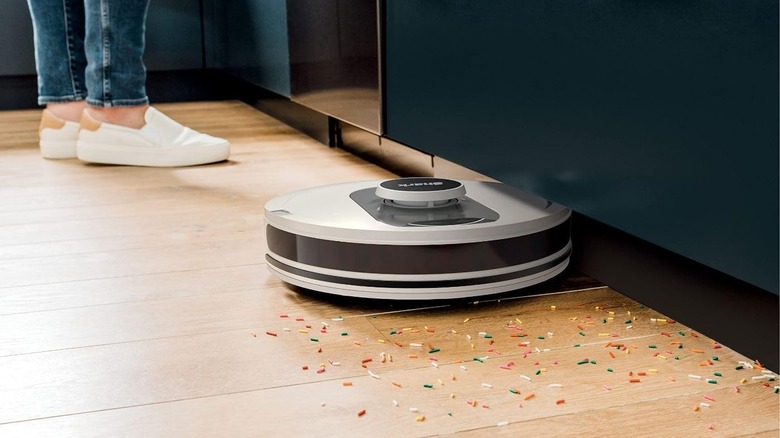 robot vacuum sweeping spilled sprinkles