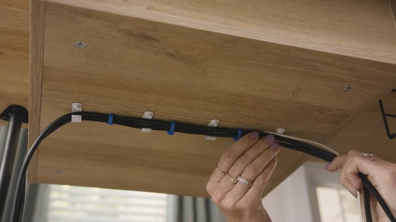 Hiding cords under table