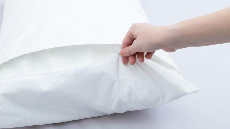 pillowcase being unzipped