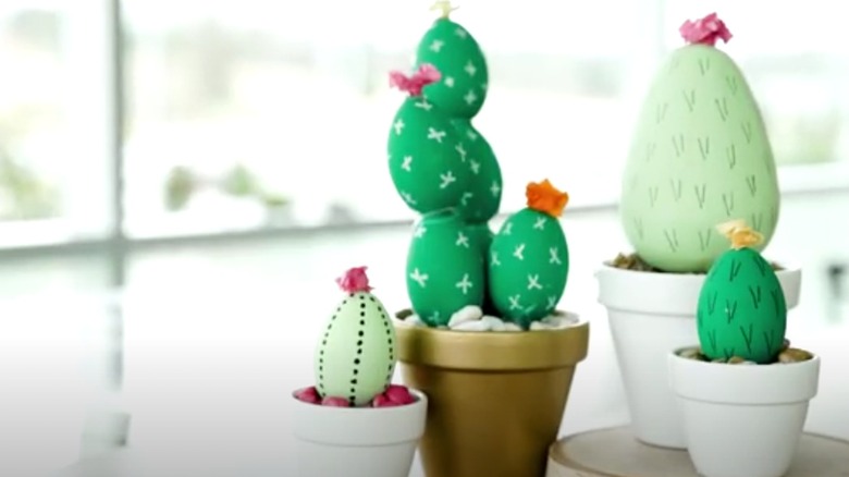 Adorable faux cacti plants made from painted plastic Easter eggs