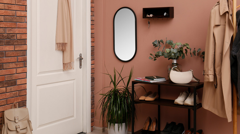 Entryway area with brownish pink painted walls