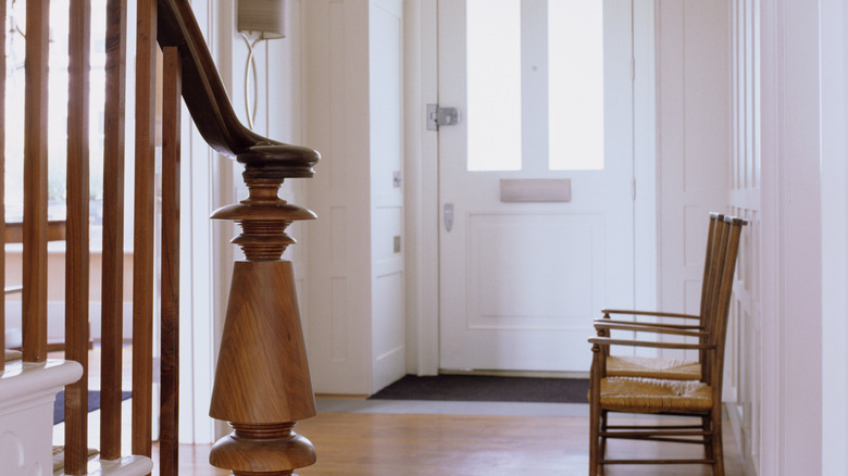 A pair of chairs near the front door