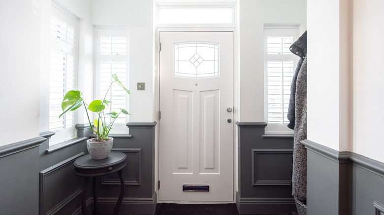 Entryway with white and gray walls