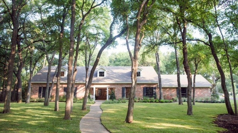 fixer upper house and trees