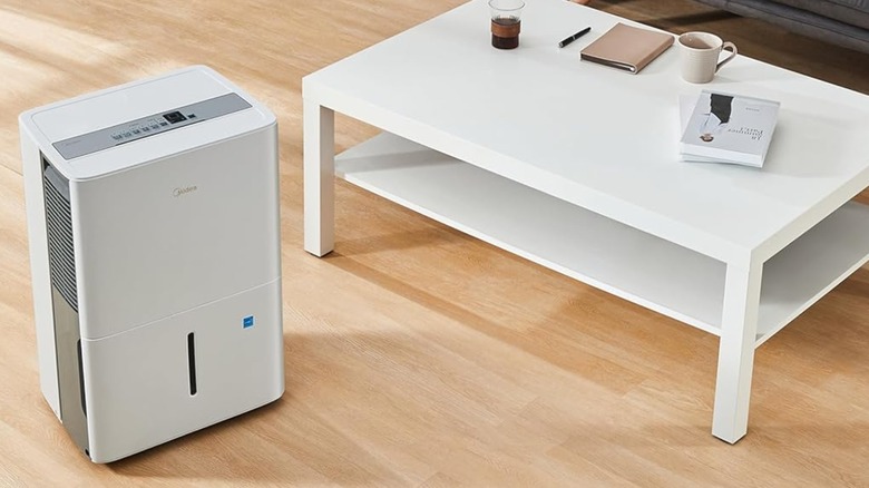 A Midea dehumidifier in a living room