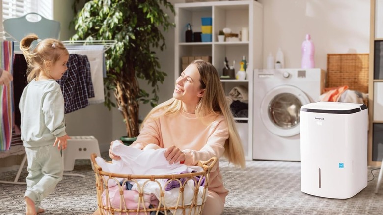 A Honeywell dehumidifier in a laundry room