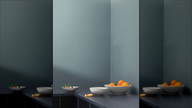 Gray-blue wall paint paired with gray counters