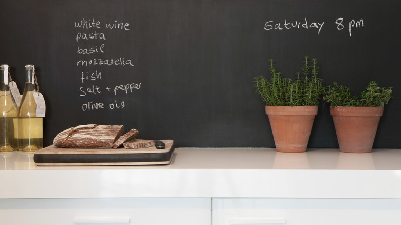 Chalkboard paint used as kitchen backsplash with ingredient list