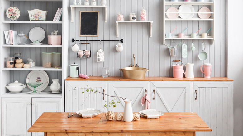 Cute farmhouse kitchen with painted wood paneling