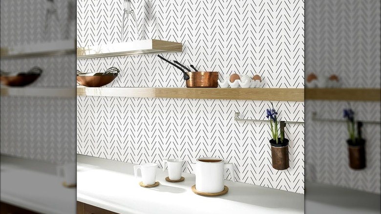 Kitchen counter with a geometric white and black wallpaper backsplash