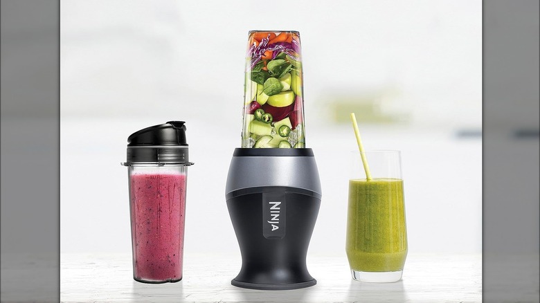 Mini blender next to smoothies