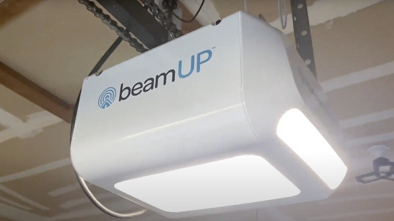 The LED lights of a beamUP garage door opener are shown in a garage