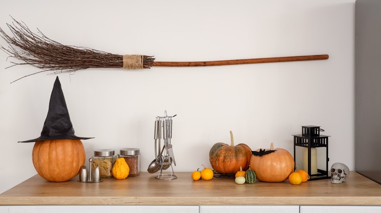 kitchen witch broom on wall