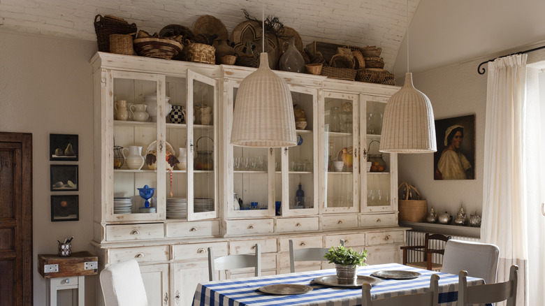 baskets store above dining room cabinet