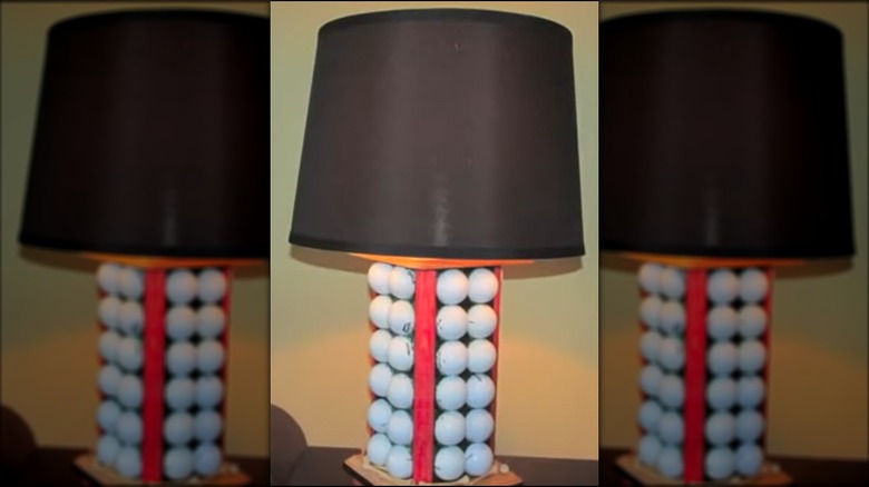 lamp made with four panels of golf balls held in glittery resin