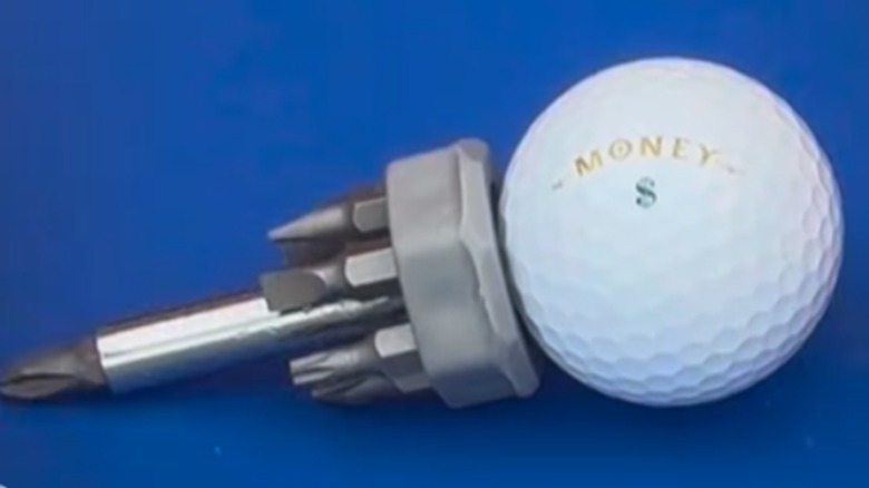 multi=head screwdriver with a golf ball as a handle