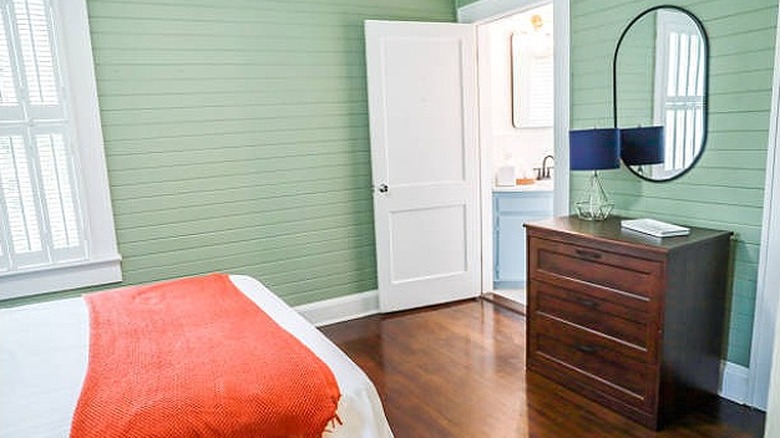 Minty shiplap guest room walls