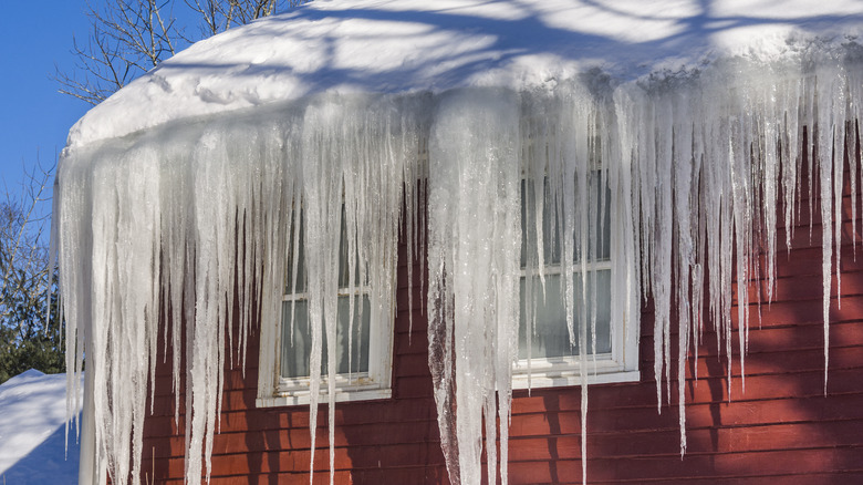 ice dam on roof of red house